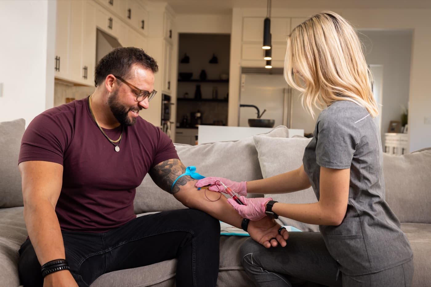 Phlebotomist performing an in-home blood draw